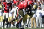 Georgia linebacker Alec Ogletree (9) takes down Georgia Techs' Synjyn Days for a loss during the third quarter of an NCAA college football game, Saturday, Nov. 24, 2012, in Athens, Ga. Georgia won 42-10. (AP Photo/John Amis)