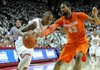NWA Media/MICHAEL WOODS -- 11/30/2012-- Arkansas guard BJ Young tries to get past past Syracuse defender James Southerland during the first half of Friday night's game at Bud Walton Arena in Fayetteville