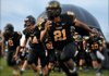 Prairie Grove is among several high schools throughout the state using inflatable mascots to introduce its team instead of players running through the traditional large paper banners before taking the field prior to games.