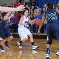 Cassandra Trexler, center, Rogers High, gets caught Thursday between Little Rock Christian’s Annalee...