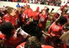 Camden Fairview players celebrate with Khiry Neal (center) following Friday night’s victory over Batesville in the Class 5A championship game at War Memorial Stadium in Little Rock. Neal, a former Cardinals defensive lineman, contracted a staph infection during fall practice in August 2010 and was left a quadriplegic. 