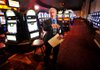 Barrett DeFay, marketing manager for the Choctaw Casino Hotel in Pocola, Okla., stands amid the establishment’s 1,180 slot machines during a tour earlier this week. 