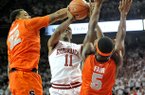 NWA Media/MICHAEL WOODS --11/30/2012-- Arkansas guard BJ Young is fouled by Syracuse defender DaJuan Coleman as he drives to the hoop during the first half of Friday night's game at Bud Walton Arena in Fayetteville. 