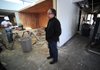 Marlon Blackwell assesses the construction going on Thursday inside the office space at 1188 N. Woolsey Ave. in Fayetteville, which will house the Northwest Arkansas Free Health Center. 
