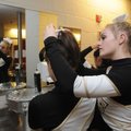 Cici Betz, 16, right, helps Sarah Steiner, 15, both members of the Bentonville dance team, with her ...