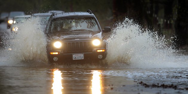 motorists-navigate-piner-road-friday-nov-30-2012-in-santa-rosa-calif-the-second-in-a-series-of-storms-slammed-northern-california-on-friday-as-heavy-rain-and-strong-winds-knocked-out-power-tied-up-traffic-and-caused-flooding-along-some-stretches