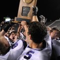 Players hoist the 7A football state championship trophy Saturday, after Fayetteville High repeated a...