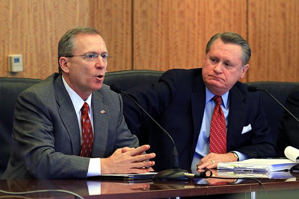Jeff Long (left) is nearing the end of eight months without a long-term football coach. 