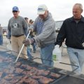 Mark Kruger, from left, Rick Stocker and James Willett grill chicken Saturday to raise money for the...