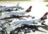 Two Boeing Co. 747 aircraft, operated by Virgin Atlantic, sit at Heathrow Airport’s Terminal 3 near London on Nov. 2. Sources say Delta Air Lines is considering the purchase of Singapore Airlines’ 49 percent stake in Virgin Atlantic. 