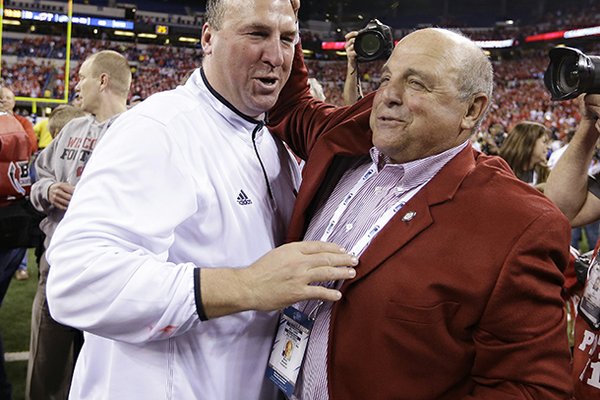 Bret Bielema (left) was named Arkansas' head coach on Tuesday. 