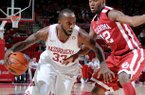 NWA Media/ANTHONY REYES -- Arkansas junior forward Marshawn Powell (33) drives around Oklahoma junior forward Amath M'Baye (22) in the first half Tuesday, Dec. 4, 2012 at Bud Walton Arena in Fayetteville.