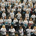 Student representatives from each school in the Bentonville Public School District wait to try out n...