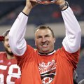 Wisconsin coach Bret Bielema holds up the trophy after Wisconsin defeated Nebraska 70-31 to win the ...