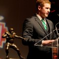 Matt McGloin, senior quarterback from Penn State, accepts the Brandon Burlsworth Trophy on Monday du...