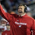 Wisconsin head coach Bret Bielema, left, stands on the sidelines during during the first quarter of ...
