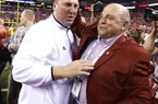 Wisconsin coach Bret Bielema, left, celebrates with athletic director Barry Alvarez after Wisconsin defeated Nebraska 70-31 to win the Big Ten dhampionship NCAA college football game Saturday, Dec. 1, 2012, in Indianapolis. (AP Photo/Darron Cummings)