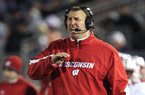 Former Wisconsin Coach Bret Bielema holds up the Big Ten Championship trophy after Wisconsin defeated Nebraska 70-31 on Saturday in Indianapolis.