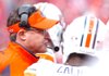 Auburn offensive coordinator Gus Malzahn talks to his players in the first quarter against Arkansas at Razorback Stadium in Fayetteville on Oct. 10, 2009. 