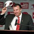 New Arkansas head coach Bret Bielema takes off his hat after being introduced during an NCAA college...