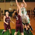 Anna Rogers, Greenland, takes a shot in the lane as Gentry’s Destiny Thomas defends Tuesday in Green...