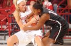 NWA Media / ANDY SHUPE -- Arkansas sophomore guard Calli Berna, left, and Texas Southern sophomore guard Janelle McQueen vie for a rebound during the first half of play Thursday, Nov. 29, 2012, in Bud Walton Arena.