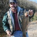 Russ Tonkinson shows a 21-inch rainbow trout, the largest fish caught during a trip to Roaring River...