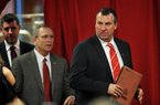 NWA Media/MICHAEL WOODS  --12/05/2012--  Bret Bielema, the new University of Arkansas head football and University of Arkansas Athletic director Jeff Long enters the room to start the press conference Wednesday afternoon at the University of Arkansas after the announcement of his hire to the football program.