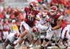 STAFF PHOTO ANDY SHUPE -- Arkansas quarterback Brandon Allen is tripped up by Alabama defensive lineman Quinton Dial during the fourth quarter of play Saturday, Sept. 15, 2012, at Razorback Stadium in Fayetteville.