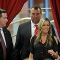 Arkansas football coach Bret Bielema follows his wife, Jen, into the Raymond Miller Room on Wednesda...