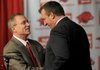NWA Media/MICHAEL WOODS --12/05/2012-- Bret Bielema, the new University of Arkansas head football coach is introduced by athletics director Jeff Long during a press conference Wednesday afternoon. 