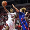 NWA Media/MICHAEL WOODS --12/06/2012-- Arkansas forward Quistelle Williams drives past Kansas defend...
