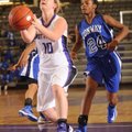 Fayetteville’s Mollie Brewer attempts to score as Conway sophomore guard Jordan Danberry defends rec...