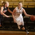 Bentonville’s Taylor Lee, right, drives to the basket during the Lady Tigers’ game Dec. 1. 