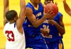 North Little Rock’s Kevaughn Allen (middle) drives to the basket against Little Rock Parkview’s Anton Beard (33) during the Charging Wildcats’ 82-68 victory over the Patriots in the Jammin’ for Jackets tournament Thursday in Little Rock. 