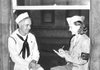Elizabeth P. McIntosh interviews a sailor in Honolulu for the Honolulu Star-Bulletin in this undated file photo. 