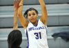 Fayetteville’s Vanessa Matlock (31) pulls up for a jumper over Little Rock Central defender Jasmine Cashaw during the Lady Bulldogs’ 49-46 loss to the Lady Tigers on Friday at the Lady Bulldog Classic in Fayetteville. 
