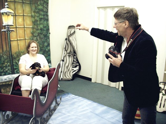 cindy-herron-of-batesville-and-her-dog-snickers-get-their-holiday-portrait-taken-by-matthew-schuetz-for-a-recent-fundraiser-for-the-humane-society-of-independence-county