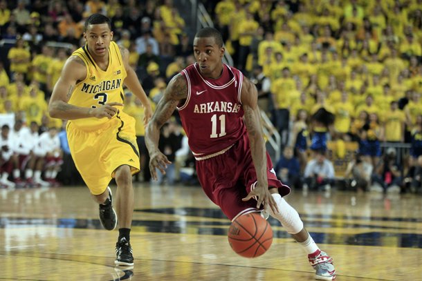 arkansas-guard-bj-young-11-drives-around-michigan-guard-trey-burke-3-during-the-first-half-of-an-ncaa-college-basketball-game-in-ann-arbor-mich-saturday-dec-8-2012-ap-photocarlos-osorio