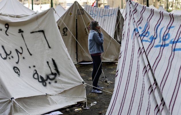 an-egyptian-protester-smokes-a-cigarette-outside-her-tent-in-tahrir-square-in-cairo-egypt-sunday-dec-9-2012-egypts-liberal-opposition-has-called-for-more-protests-on-sunday-after-the-president-made-concessions-overnight-that-fell-short-of-their-demands-to-rescind-a-draft-constitution-going-to-a-referendum-on-dec-15