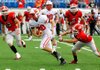 Harding Academy’s Caleb Spears (center) runs between Glen Rose’s Tyler Lewis (right) and Collin Hunter (12) to score the go-ahead touchdown with six seconds remaining in Saturday’s Class 3A championship game at War Memorial Stadium in Little Rock. Glen Rose scored to take a 45-42 lead with 1:11 remaining before the Wildcats drove 73 yards in seven plays for the winning score. 