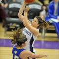 Sydney Crockett of Fayetteville High drives to the hoop past Mountain Home defender Katie Kapler dur...