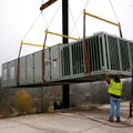 Sean DePeel, left, with Barbee Equipment and John Doyle with Action Mechanical help Saturday guide a...