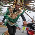 Leonardo Lopez from La Danza Azteca dances his way down North Whippoorwill Court in Fayetteville on ...