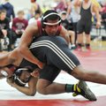 Calvin Bloomingburg (bottom) of Little Rock Central and Springdale’s Johnny Lemari during their matc...