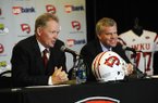 New Western Kentucky head coach Bobby Petrino, left, speaks with athletic director Todd Stewart during an NCAA college football news conference, Monday, Dec. 10, 2012, in Bowling Green, Ky. The 51-year-old was fired by Arkansas in April for a "pattern of misleading" behavior following an accident in which the coach was injured while riding a motorcycle with his mistress as a passenger but now wants to make the most of his second chance. (AP Photo/The Daily News, Joe Imel)