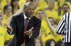 Arkansas head coach Mike Anderson argues a call during the first half of an NCAA college basketball game against Michigan in Ann Arbor, Mich., Saturday, Dec. 8, 2012. (AP Photo/Carlos Osorio)