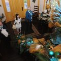 Sandy Baumhover, from left, Missy Baumhover, 10, and Rita Baumhover observe the Christmas decoration...