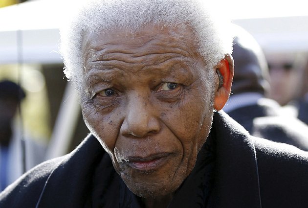 former-south-african-president-nelson-mandela-leaves-the-chapel-after-attending-the-funeral-of-his-great-granddaughter-zenani-mandela-in-johannesburg-in-this-june-17-2010-file-photo