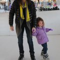 Jennifer Faddis of Centerton and her daughter, Emma Faddis, 4, skate on Tuesday at the free rink ins...